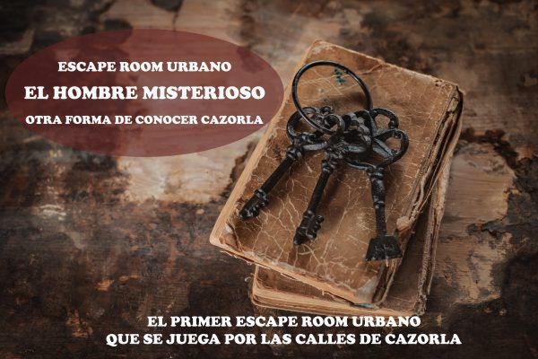 old vintage keys on an old battered book, antique wooden background. The concept of mystery and discovery, answers to questions, a clue.